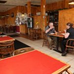 A man and woman enjoy a pizza in Veneta, Oregon, at Countryside Pizza Grill