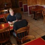 A man and woman enjoy a pizza in Veneta, Oregon, at Countryside Pizza Grill